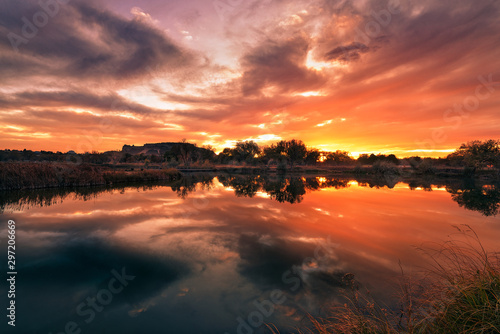 sunset in mountains with reflection in Lake