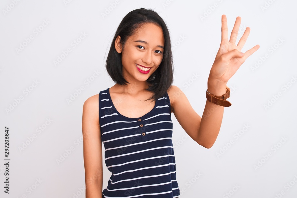 Young chinese woman wearing striped t-shirt standing over isolated white background showing and pointing up with fingers number four while smiling confident and happy. Young chinese woman wearing striped t-shirt standing over isolated white background showing and pointing up with fingers number four while smiling confident and happy.