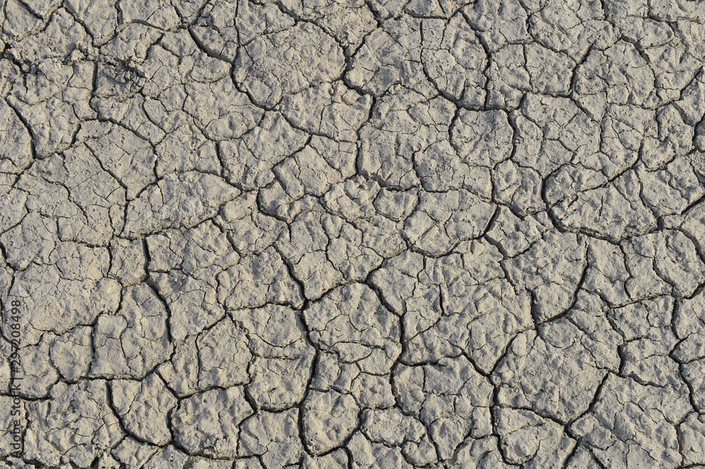 dry season with very arid terrain and little water broken soil virtually no vegetation dry season with very arid terrain and little water broken soil virtually no vegetation