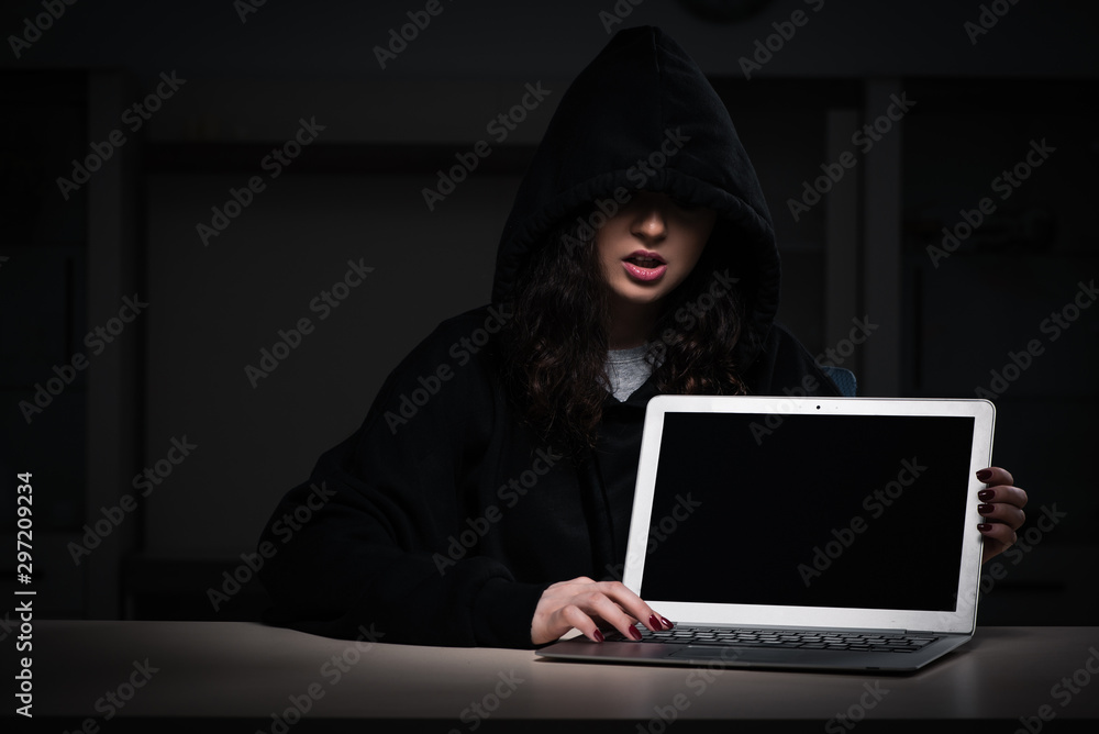 Female hacker hacking security firewall late in office Female hacker hacking security firewall late in office