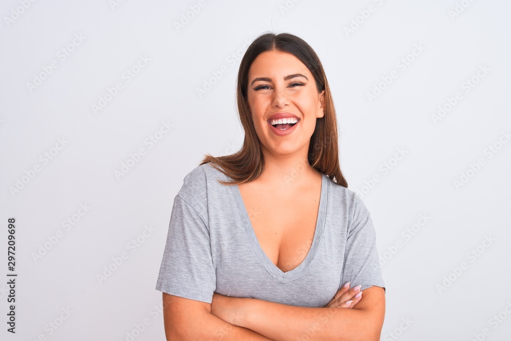 Portrait of beautiful young woman standing over isolated white background happy face smiling with crossed arms looking at the camera. Positive person. Portrait of beautiful young woman standing over isolated white background happy face smiling with crossed arms looking at the camera. Positive person.