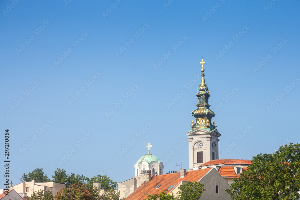 Panorama of the old city of Belgrade with a focus on Saint Michael Cathedral, also known as Saborna Crkva, with its iconic clocktower seen from afar. belgrade is the capital city of Serbia