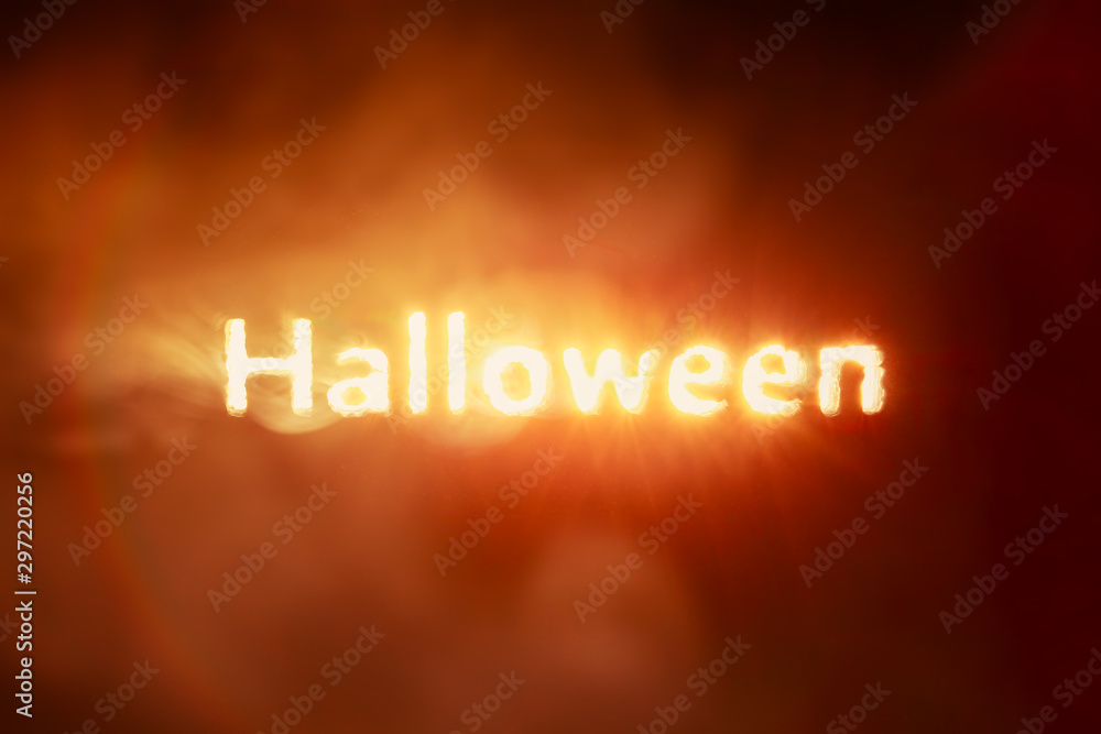 Glowing Halloween text burning red and orange smoke
