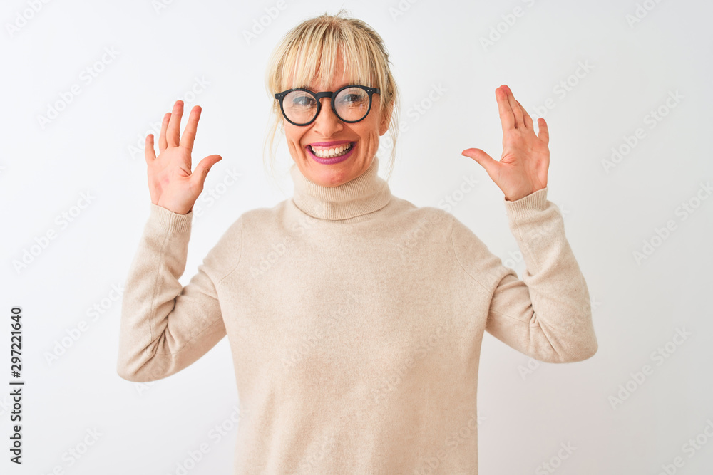 Middle age woman wearing turtleneck sweater and glasses over isolated white background showing and pointing up with fingers number ten while smiling confident and happy. Middle age woman wearing turtleneck sweater and glasses over isolated white background showing and pointing up with fingers number ten while smiling confident and happy.