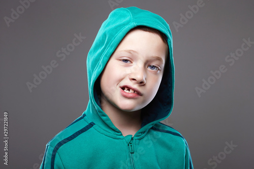 Billede på lærred expression little boy in hood. enjoy grimace emotion kid