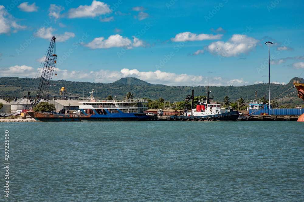 Ships at the harbor of Puerto Plata, cranes, mountain view, Dominican Republic