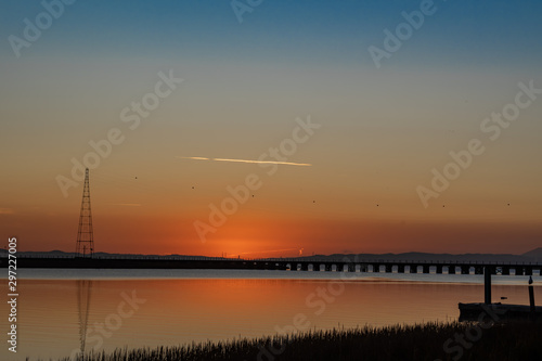 Sunrise over the Napa river along the railroad bridge