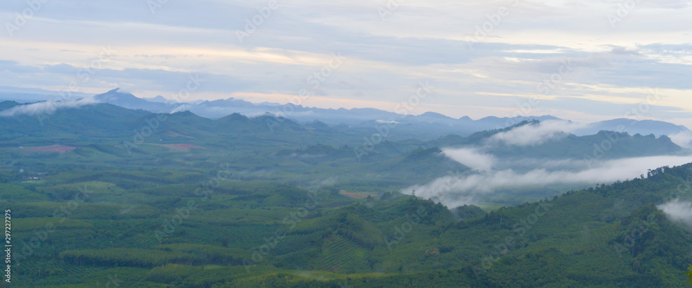 Beautiful sky cloud and fog above green mountains. Wangpamek, Trang, Thailand.