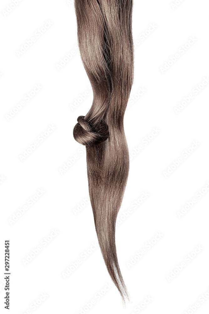 Brown hair knot isolated on white background. Long straight ponytail Brown hair knot isolated on white background. Long straight ponytail