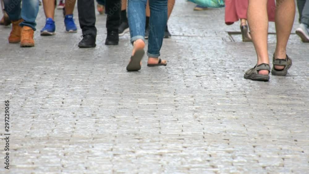 Concept crowd feet with shoes closeup. Anonymous people walking on the street. Legs of Crowd People Walking on the Street Concept crowd feet with shoes closeup. Anonymous people walking on the street. Legs of Crowd People Walking on the Street