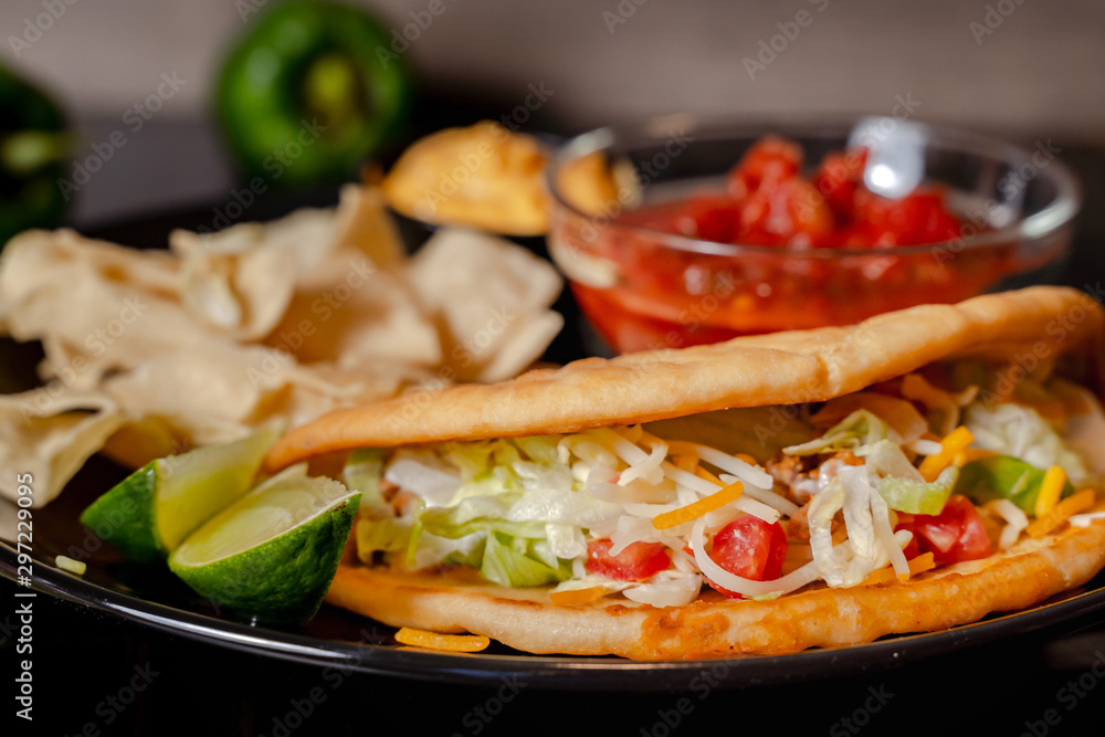 Close up Homemade Baja beef Tacos salad with tomato Salsa and Chips - mexican food Close up Homemade Baja beef Tacos salad with tomato Salsa and Chips - mexican food