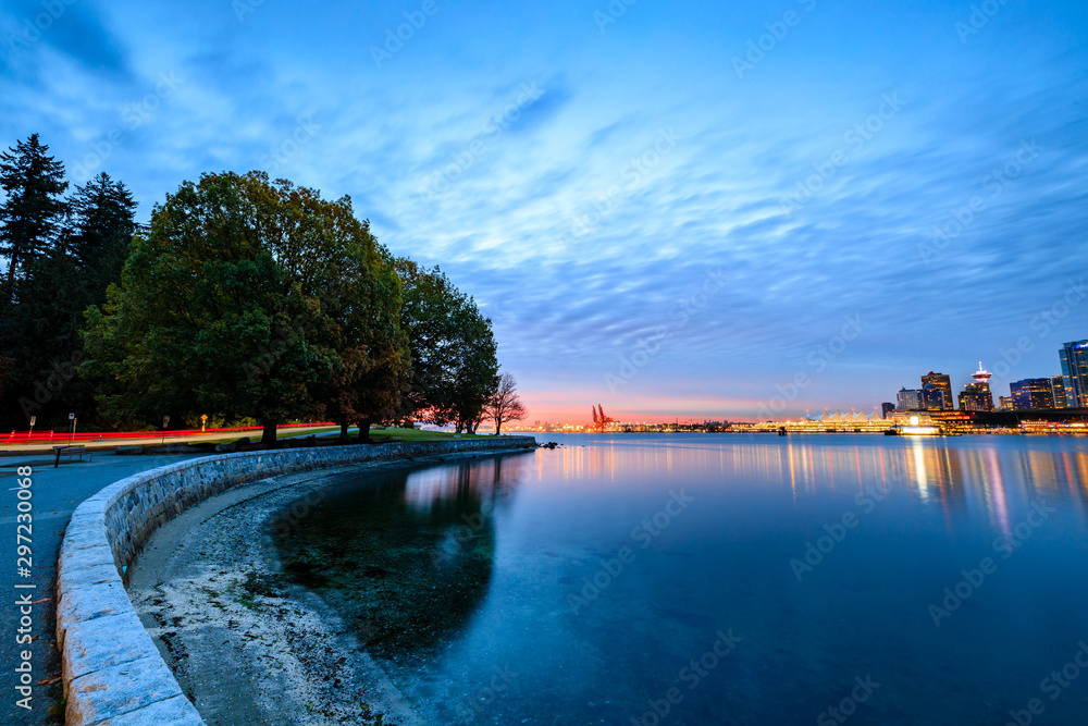 Light trail along Vancouver seawall during October sunrise