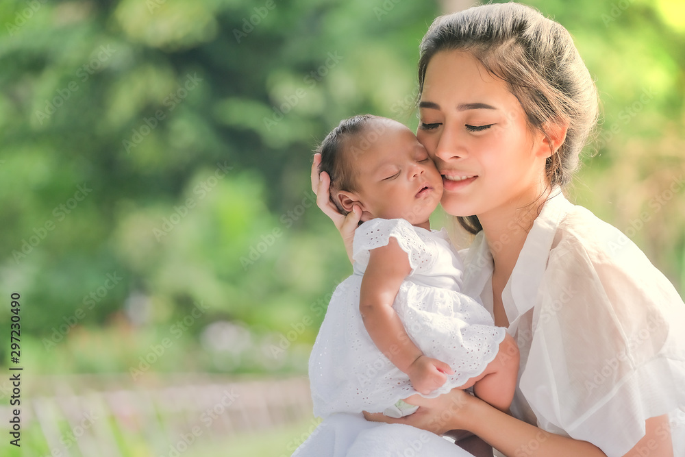 Beautiful mother and baby in an Asian park Beautiful mother and baby in an Asian park