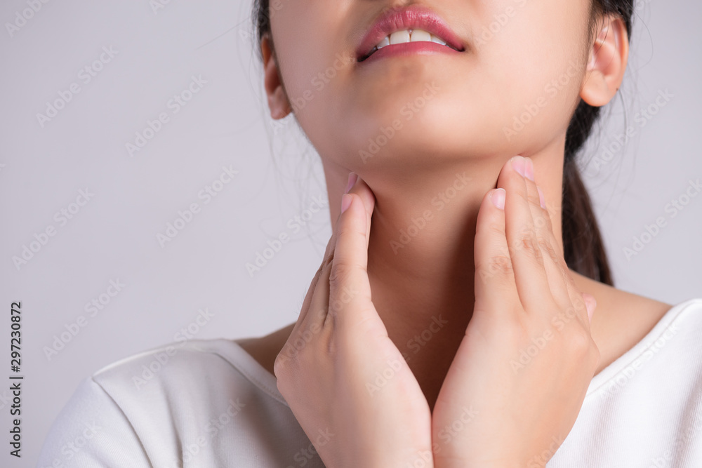 Sore Throat. Closeup Of Beautiful Young Woman Hand Touching Her Ill Neck. Healthcare and medical concept. Sore Throat. Closeup Of Beautiful Young Woman Hand Touching Her Ill Neck. Healthcare and medical concept.