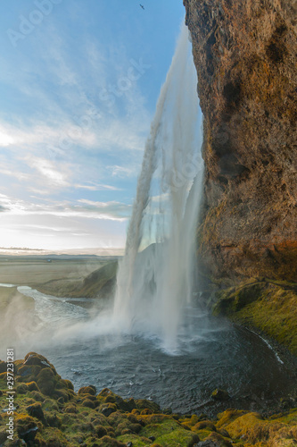 Waterfall Seljalandsfoss (part of Seljalands river taking its origin in Eyjafjallajökull volcano glacier) in southern Iceland, as seen in sunset hour © Andrew Sild