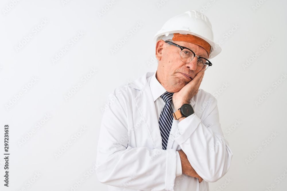 Senior grey-haired engineer man wearing coat and helmet over isolated white background thinking looking tired and bored with depression problems with crossed arms. Senior grey-haired engineer man wearing coat and helmet over isolated white background thinking looking tired and bored with depression problems with crossed arms.