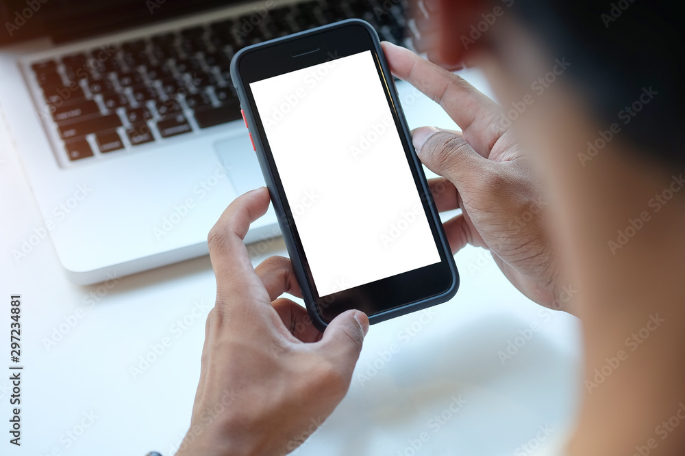 Cropped shot view of man hands holding smart phone with blank copy space screen for your text message or information content, female reading text message on cell telephone during in urban setting. Cropped shot view of man hands holding smart phone with blank copy space screen for your text message or information content, female reading text message on cell telephone during in urban setting.