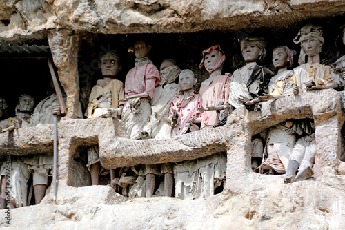 Tau-Tau’s (Guardians of the Dead) at the Suaya Cliffs Burial Site, Toraja, Sulawesi, Indonesia photo