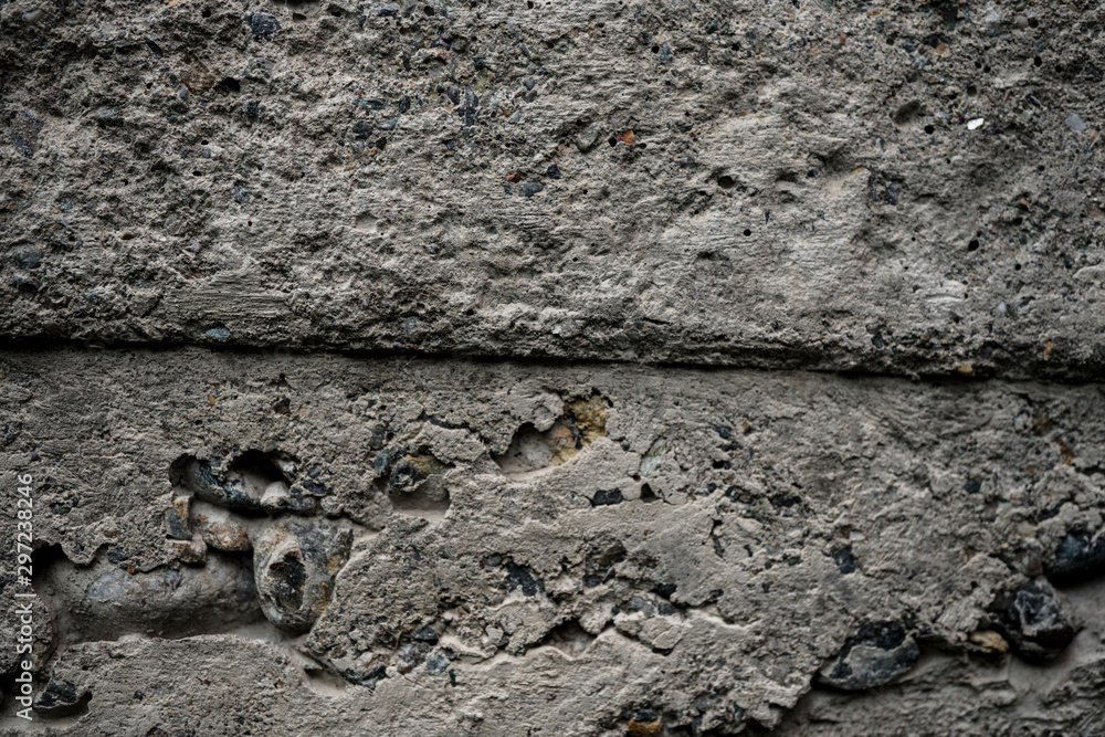 Fototapeta premium Texture of uneven old concrete slab. Background image macro photo of concrete