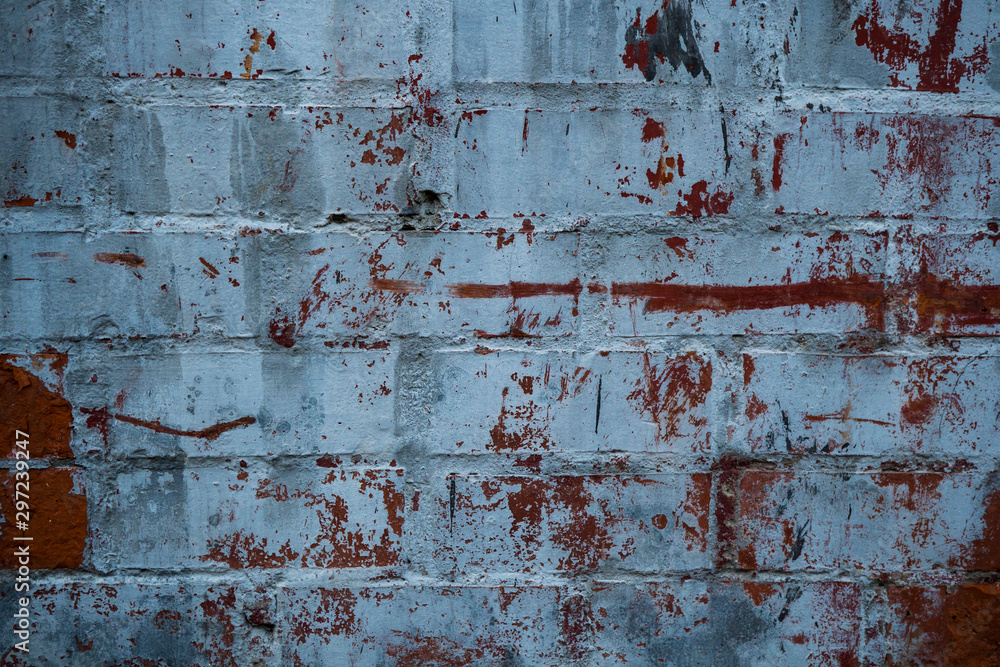 Texture of an old paint covered brick wall. Background image of an abandoned brick wall with painted over paint Texture of an old paint covered brick wall. Background image of an abandoned brick wall with painted over paint
