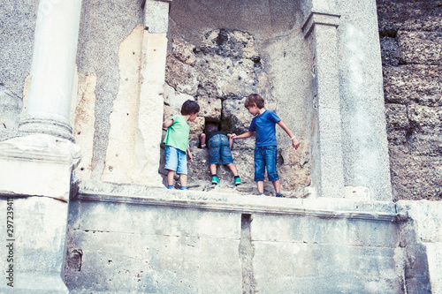 little boy exploring ancient architecture, lifestyle people on summer vacation close up © iordani