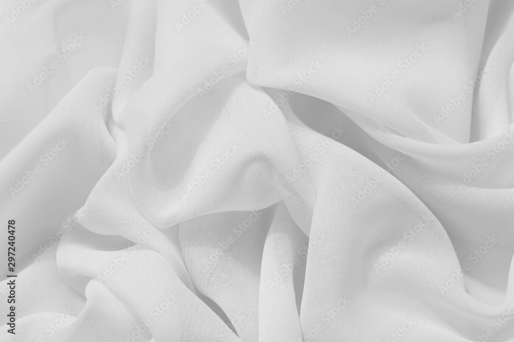 Obraz premium Light draped chiffon fabric in light color for festive backgrounds