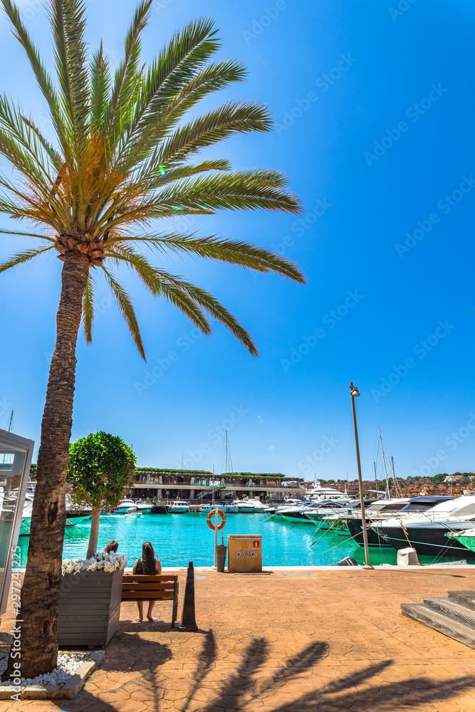Majorca, Spain - June 1st 2018: Beautiful promenade of Port Adriano with luxury yachts boats