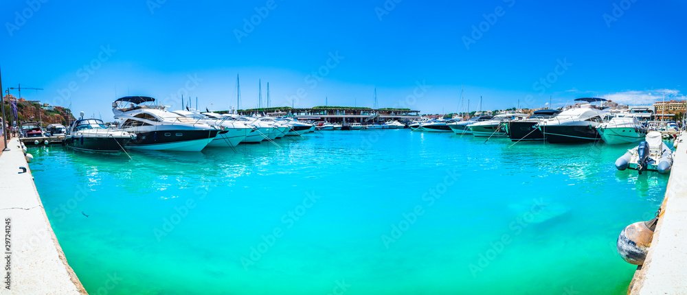 Majorca, Spain - June 2018: Luxury yachts at marina of Port Adriano on Mallorca, Mediterranean Sea, Balearic Islands