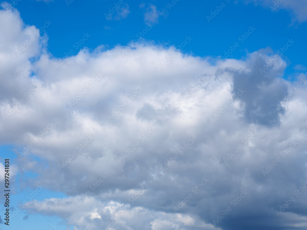 Gray clouds on a blue sky background Gray clouds on a blue sky background