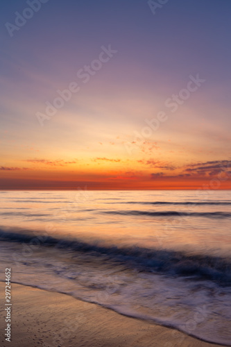 Colourful sky over the north sea after sunset at the beach on Juist, East Frisian Islands, Germany. © DirkR