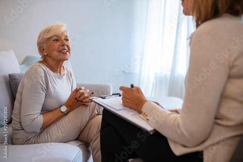 Geriatric psychology, mental therapy and old age concept - Senior woman patient and psychologist at psychotherapy session. Senior woman talking with female psychologist
