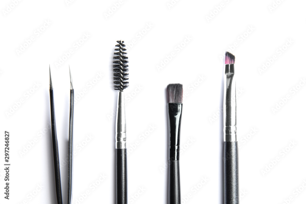 Set of professional eyebrow tools on white background, top view Set of professional eyebrow tools on white background, top view