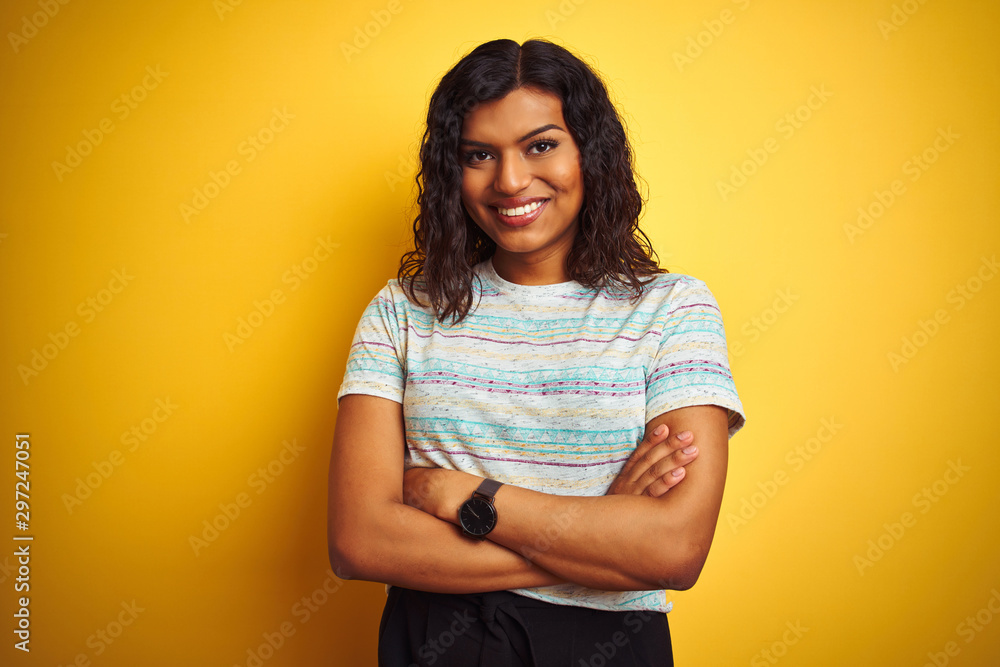 Foto de Beautiful transsexual transgender woman wearing t-shirt over isolated yellow background