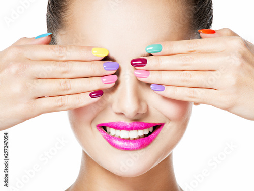 woman with colored nails and pink lips