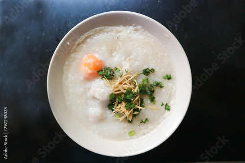 rice gruel or congee with egg and pork photo