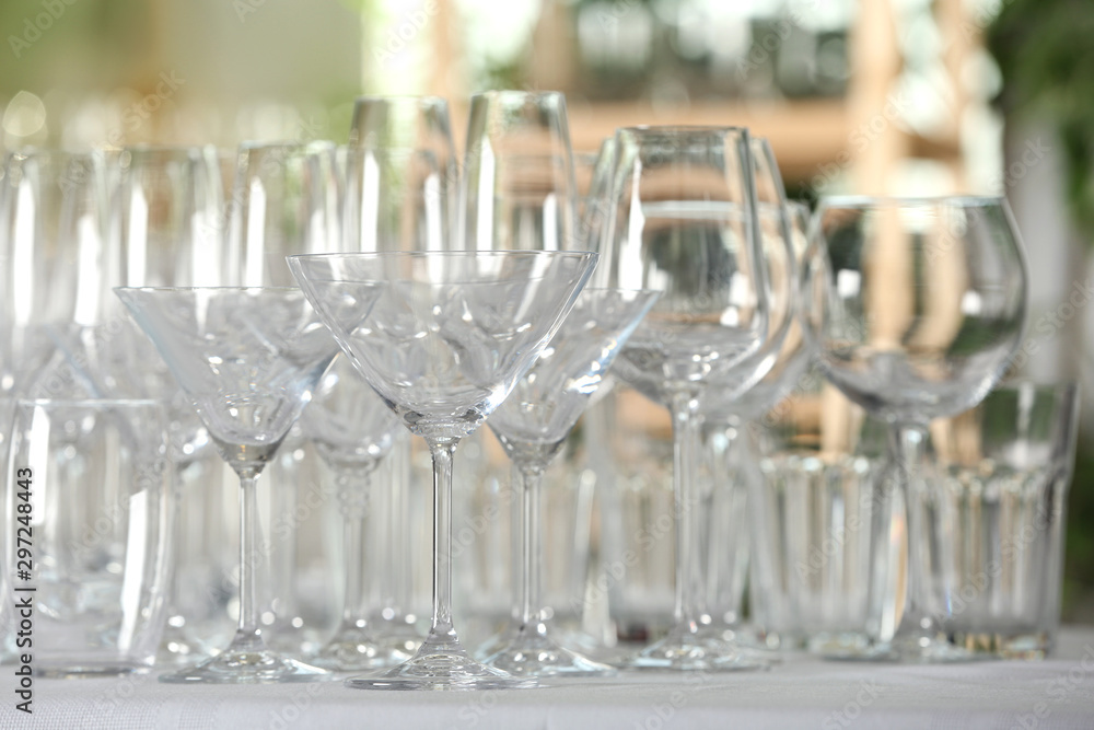 Set of empty glasses on table indoors Set of empty glasses on table indoors