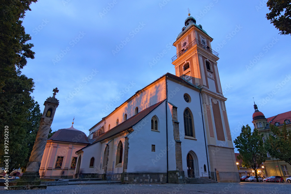 Maribor, Slovenia-September 24, 2019: Stunning autumn view of Maribor Cathedral during sunrise, dedicated to Saint John the Baptist. It is a Roman Catholic cathedral in the city of Maribor