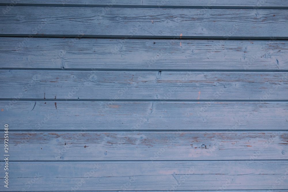 Horizontal format of a wooden wall painted blue Horizontal format of a wooden wall painted blue