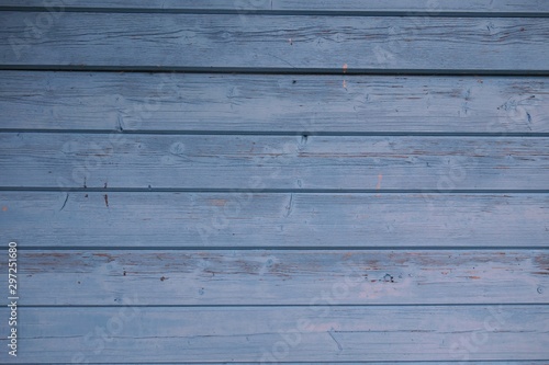 Horizontal format of a wooden wall painted blue