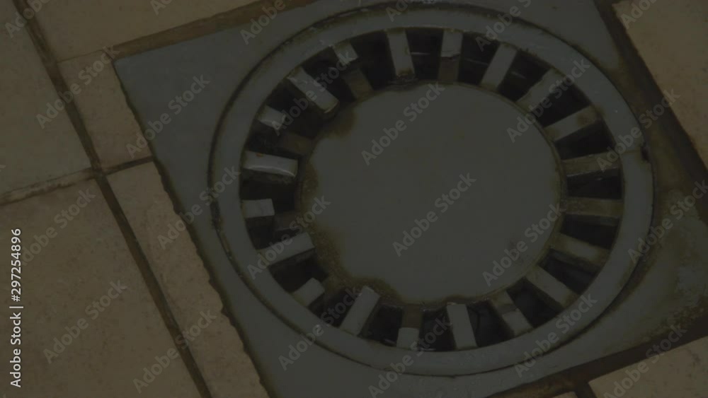 Water pouring down dirty and broken shower drain Water pouring down dirty and broken shower drain