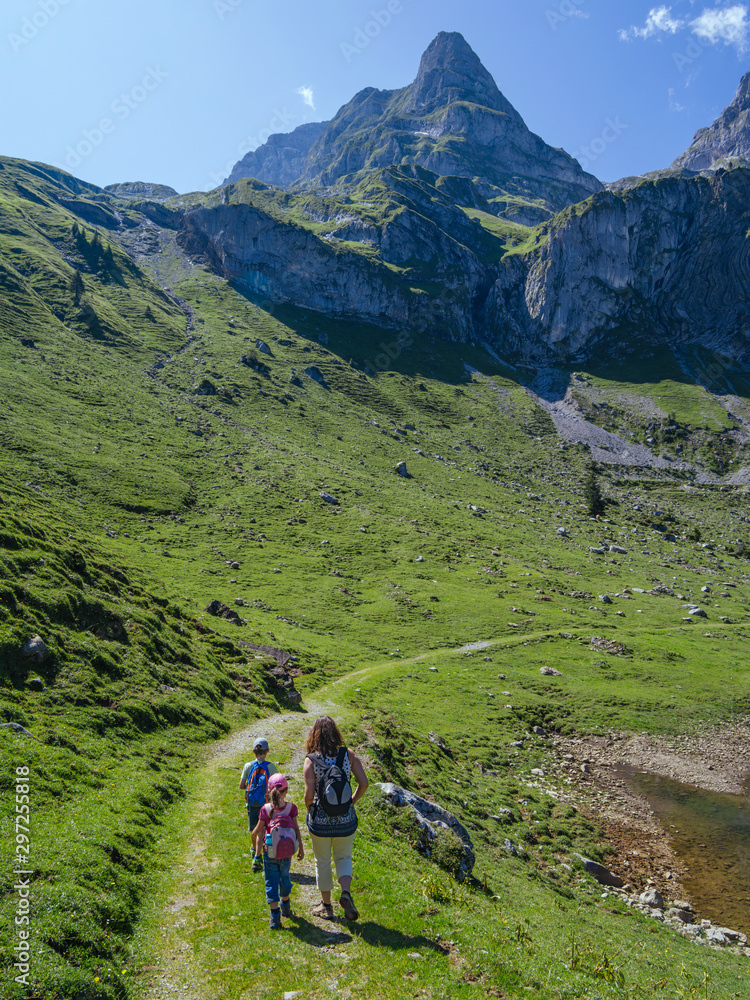 Young family hiking around Bannalp in Switzerland