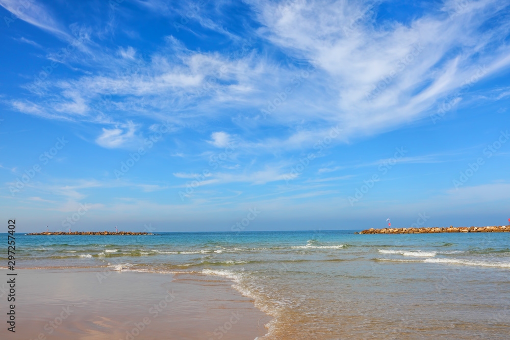 Gorgeous calm blue sea and free sand beaches of Tel Aviv. Beautiful sea surf and blue sky. Magical comfortable warm autumn mild season of Mediterranean 