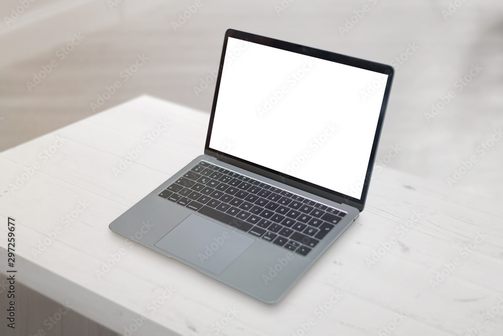 Laptop mockup on clean office desk close-up.