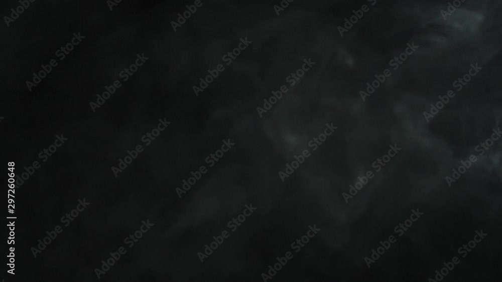 Roasted coffee beans thrown up from through the white smoke on black background. Smoky steamy fragrant fresh flying coffee beans. Slow Motion. Roasted coffee beans thrown up from through the white smoke on black background. Smoky steamy fragrant fresh flying coffee beans. Slow Motion.