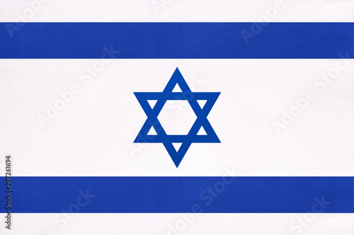 Israel national fabric flag, textile background. Symbol of international world east country.
