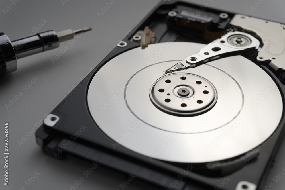 Close up of hard disk's internal mechanism hardware. Soft focus at middle and background. Close up of hard disk's internal mechanism hardware. Soft focus at middle and background.