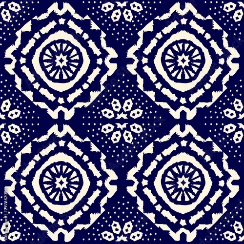 Abstract indigo shibori seamless vector pattern with ikat print of mosaic
