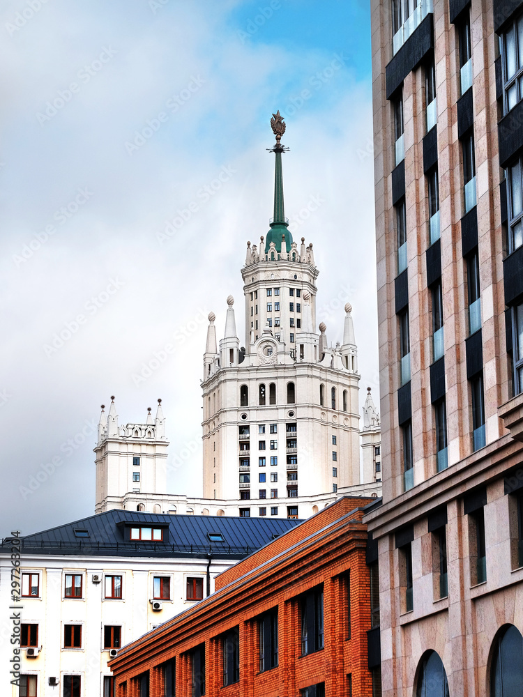View of urban development and high-rise building with a spire and a star 