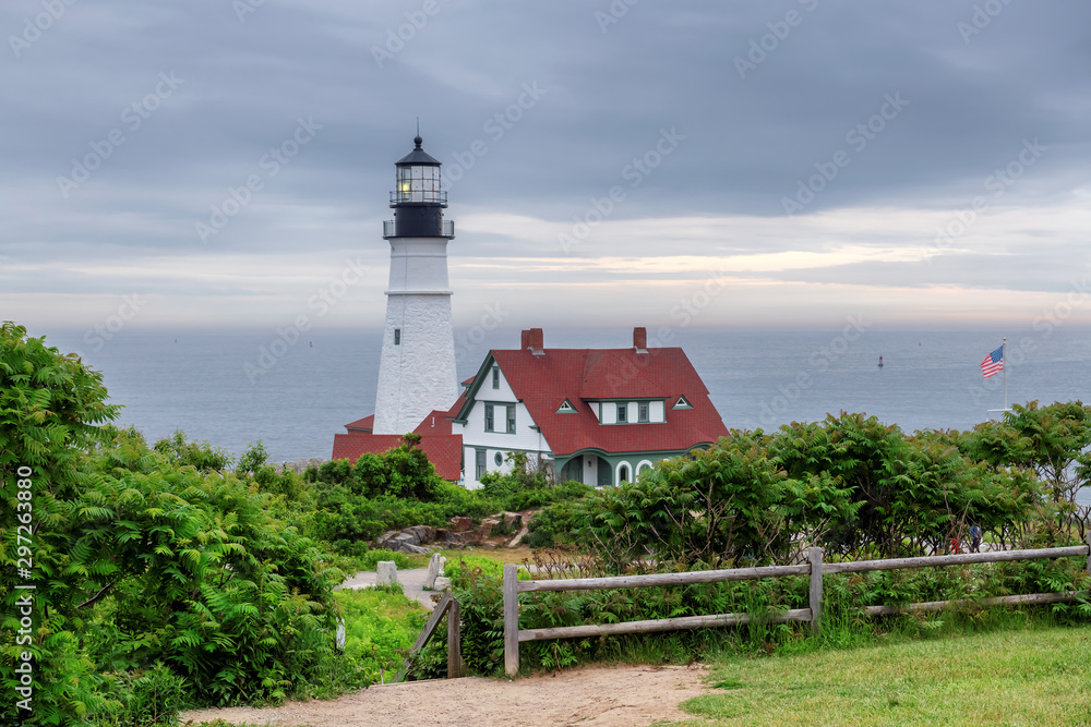 Portland Head Lighthouse at morning dramatic sky in Cape Elizabeth, Maine, USA. Portland Head Lighthouse at morning dramatic sky in Cape Elizabeth, Maine, USA.