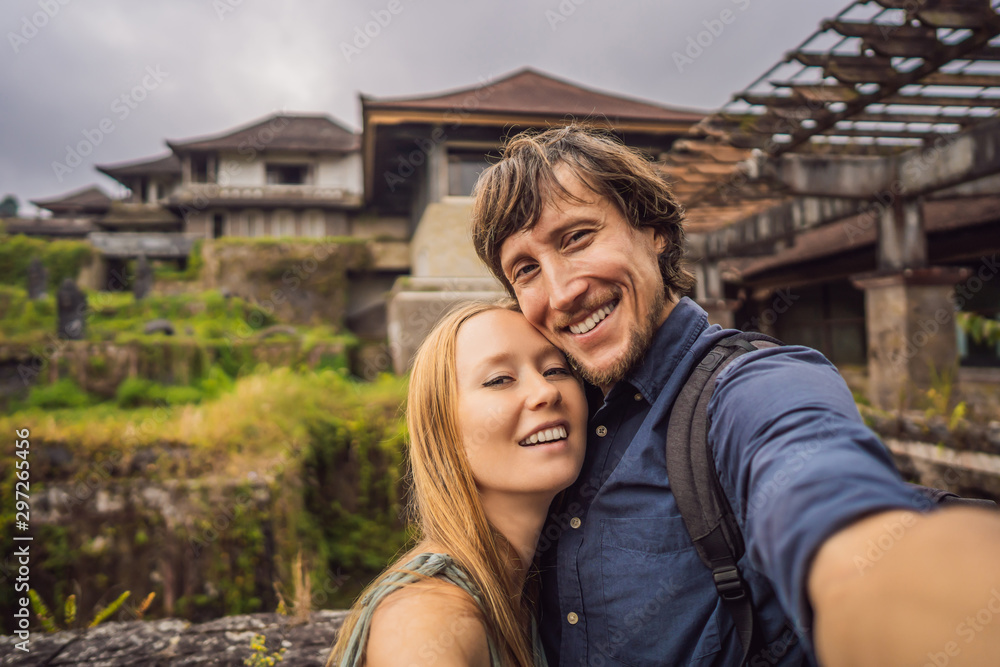 Happy couple in love in abandoned and mysterious hotel in Bedugul. Indonesia, Bali Island. Honeymoon in Bali